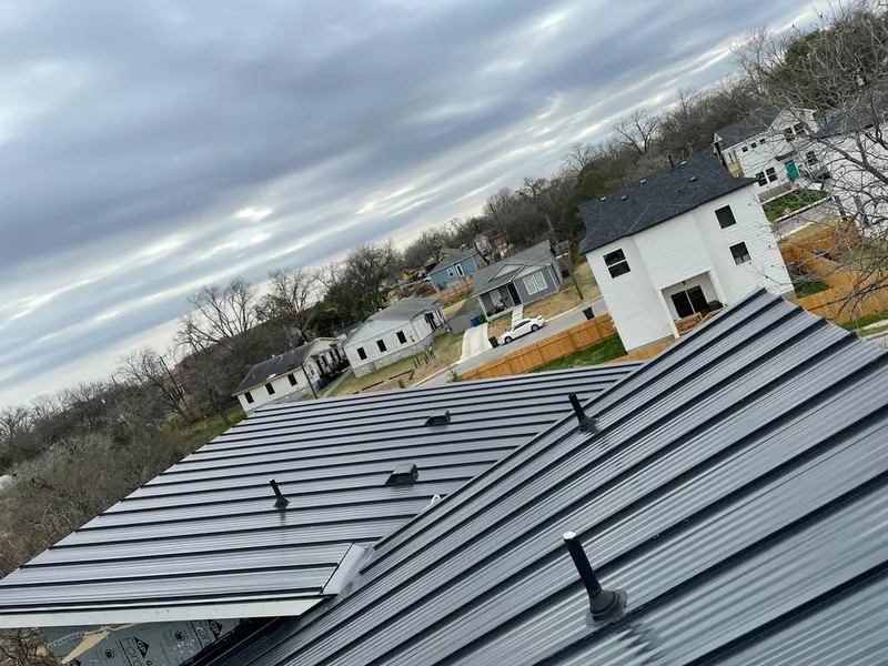Standing seam metal roof panels with vents for Skylight Repair in Frisco